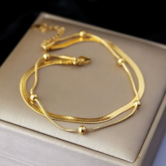 Double Ankle Bracelet with Gold Plating in Stainless Steel – Elegance and Protection for Your Special Moments